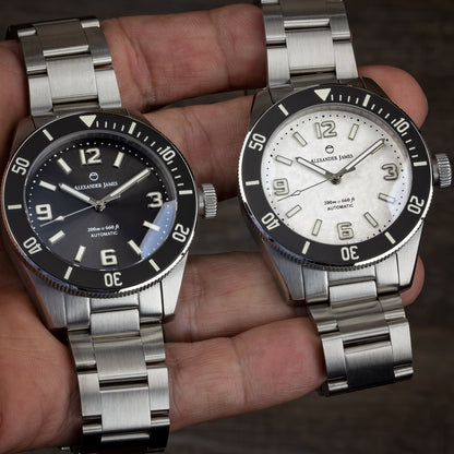 photo of 2 completed watches using the watch case. one black and one white being held in a hand. 