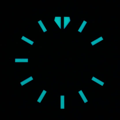 photo of watch dial in the dark